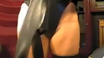 Girl in latex tight dress and mask on webcam