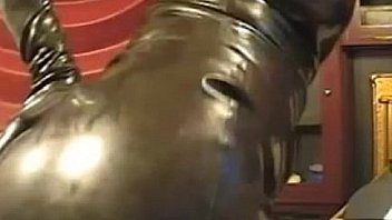 Girl in latex tight dress and mask on webcam