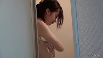 A japanese college student returns home to her apartment and washes her body in the shower