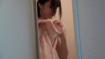 A japanese college student returns home to her apartment and washes her body in the shower