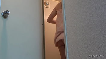 A japanese college student returns home to her apartment and washes her body in the shower