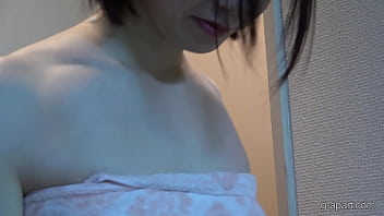 A japanese college student returns home to her apartment and washes her body in the shower