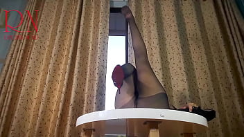 Nice lady in pantyhose and heels striptease at the round table 33