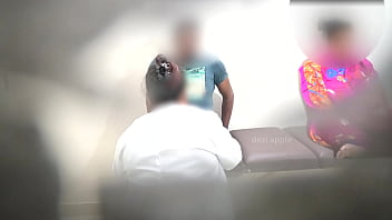 Doctor using patient when nurse is sitting nearby