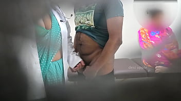 Doctor using patient when nurse is sitting nearby