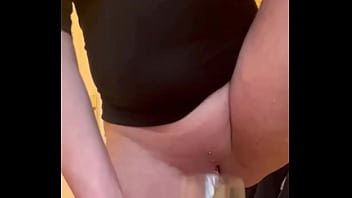 Filled up two glasses by my strong stream pee and next put in my mouth and spitting on my big tits