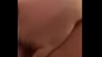 Fingering her shaved pussy