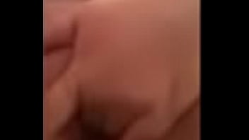 Fingering her shaved pussy