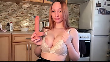 A young cook decided to play with a vibrator while cooking in the kitchen