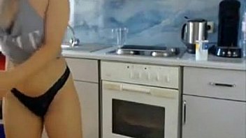 Blonde teasing in the kitchen