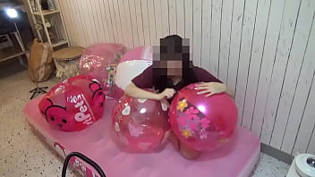 Japanese girl deflating the beachballs