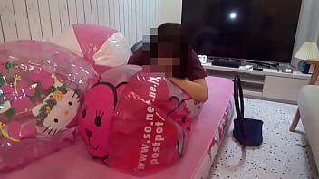 Japanese girl deflating the beachballs Japanese girl deflating the beachballs