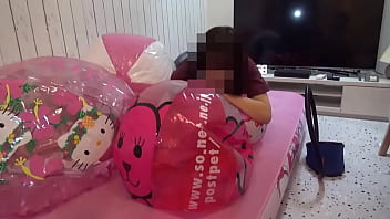 Japanese girl deflating the beachballs