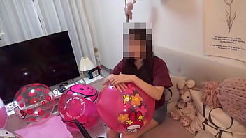 Japanese Girl Deflating The Beachballs thumbnail