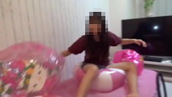 Japanese girl deflating the beachballs