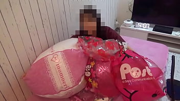 Japanese girl deflating the beachballs