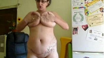 Nerdy milf puts a dildo inside front the webcam