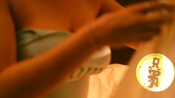 Brunette with huge tits playing with her luscious melons