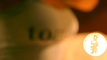 Brunette with huge tits playing with her luscious melons