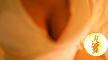 Brunette with huge tits playing with her luscious melons