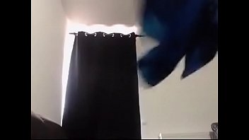 Sexy brunette dances while oiling up playing