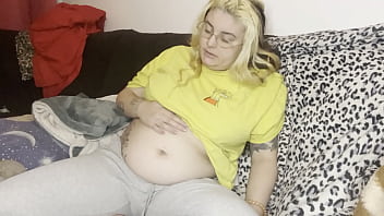 Massage of the swollen belly burping the couch