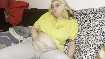 Massage of the swollen belly burping the couch