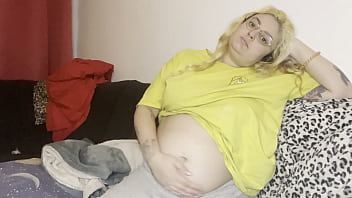 Massage of the swollen belly burping the couch