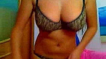 Busty brunette gets naked in front the webcam