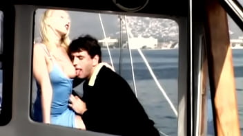 On the boat out at sea gina has sex with a man wearing a suit