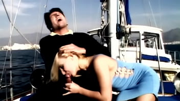 On the boat out at sea gina has sex with a man wearing a suit