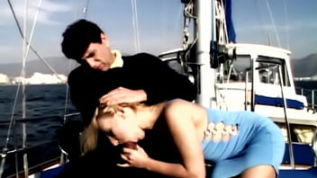 On the boat out at sea gina has sex with a man wearing a suit