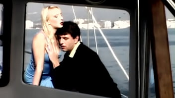 On the boat out at sea gina has sex with a man wearing a suit