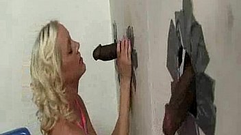 Sucking big black cock at gloryhole