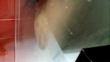 Under the shower natural breasts