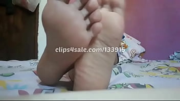 Reeta would love to perform a footjob on you with her wide meaty soles