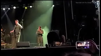 Black girl takes a piss on a man at live concert