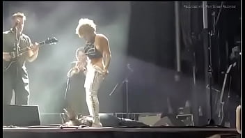 Black girl takes a piss on a man at live concert