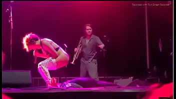 Black girl takes a piss on a man at live concert Black girl takes a piss on a man at live concert