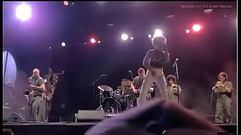 Black girl takes a piss on a man at live concert