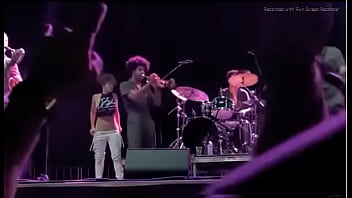 Black girl takes a piss on a man at live concert