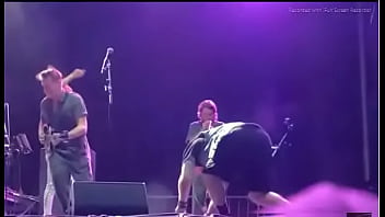 Black girl takes a piss on a man at live concert Black girl takes a piss on a man at live concert