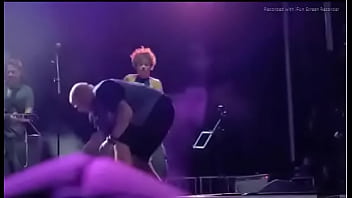 Black girl takes a piss on a man at live concert