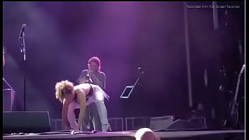 Black girl takes a piss on a man at live concert
