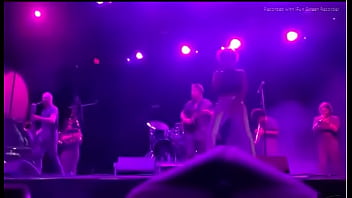 Black girl takes a piss on a man at live concert