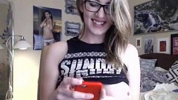 Busty girl with glasses showing her great body