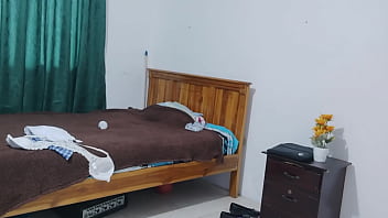 A female student in a dress dresses in her apartment she's a friendly humble busty woman