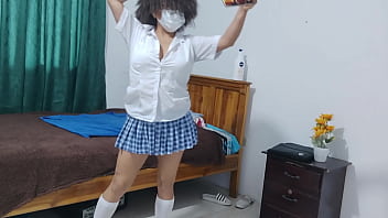 A female student in a dress dresses in her apartment she's a friendly humble busty woman