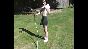 Zoe plays with water hose wetting pierced tits & her pussy