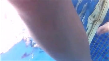 A woman with a dazzling swimsuit is popping